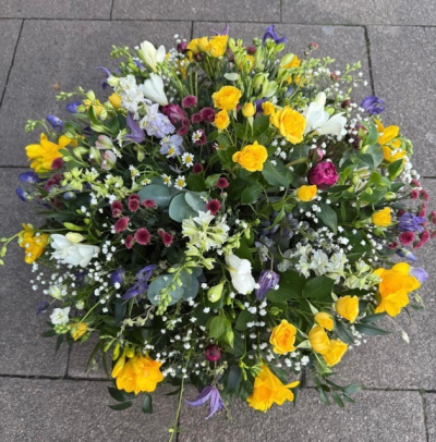 Meadow Posy - A selection of dainty delicate flowers in a bright array of colours arranged in a round posy style design. Sizes available Standard 14" Medium 16" Large 18".  Colour changes are available on request, delivered by your local florist Susettes flowers.